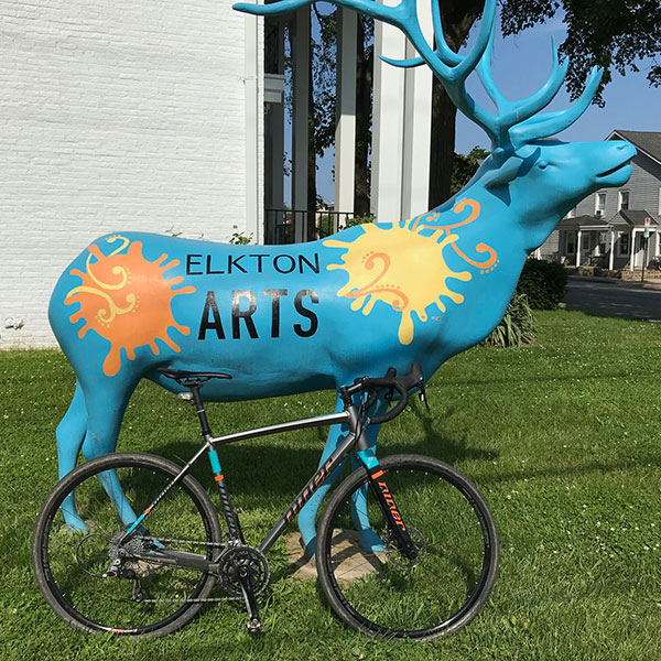 My bike next to a moose statue in Elkton, MD